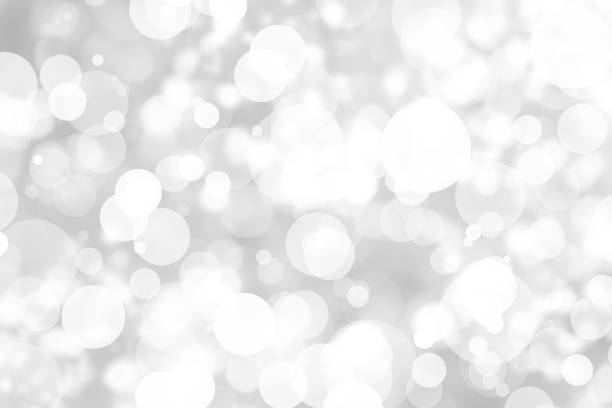 istock Abstract background with White bokeh on gray background. christmas blurred beautiful shiny Christmas lights. 897146866