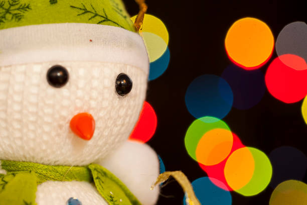 istock Festive snowman with Christmas light background 897149382