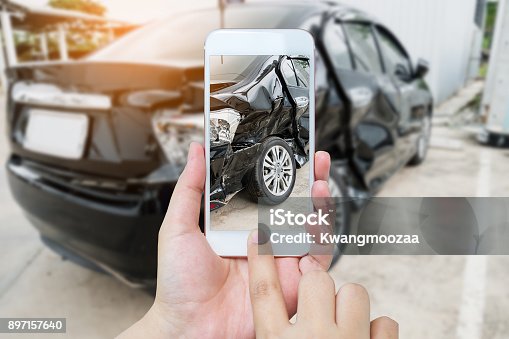 istock female hold mobile smartphone photographing car accident 897157640