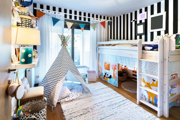 Kid bedroom with teepee and bunk bed. Kids bedroom with bunk wooden bed, teepee, stands, carpet frames and toys. kids room furniture
