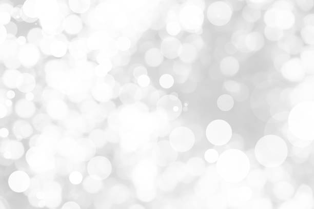 istock Abstract background with White bokeh on gray background. christmas blurred beautiful shiny Christmas lights. 897158166