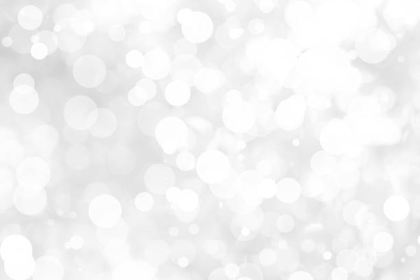istock Abstract background with White bokeh on gray background. christmas blurred beautiful shiny Christmas lights. 897158936