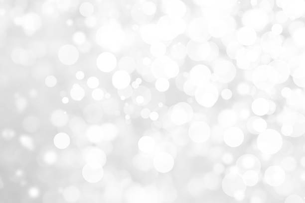istock Abstract background with White bokeh on gray background. christmas blurred beautiful shiny Christmas lights. 897160998