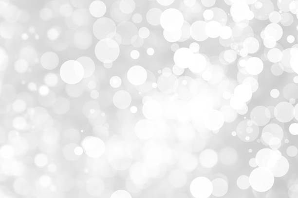 istock Abstract background with White bokeh on gray background. christmas blurred beautiful shiny Christmas lights. 897161266