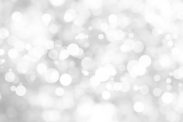 istock Abstract background with White bokeh on gray background. christmas blurred beautiful shiny Christmas lights. 897161282
