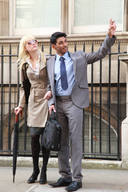 istock Young Couple calling a taxi 897163332