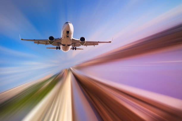 istock Airplane in motion over roadway 897173642
