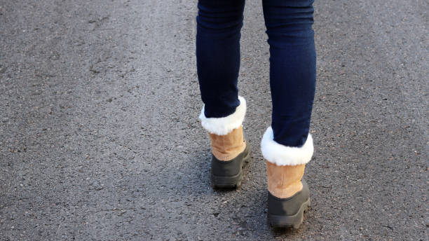 istock A woman walking wear winter boots. 897186296