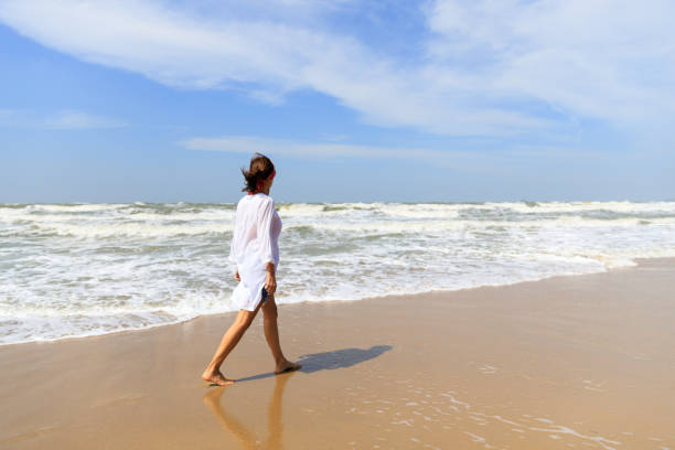 istock Happy woman on beach 897212512