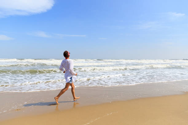 istock Happy woman on beach 897212518