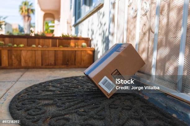 Cardboard Package Delivery At Front Door Stock Photo - Download Image Now - Box - Container, Package, Door