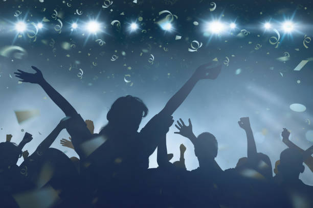 istock Crowd of happy people watching New Year celebratio 897220742
