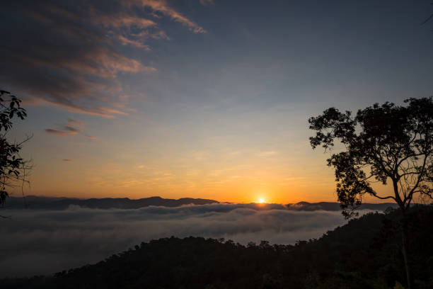 istock Fog and sun on the mountain view point 897220800