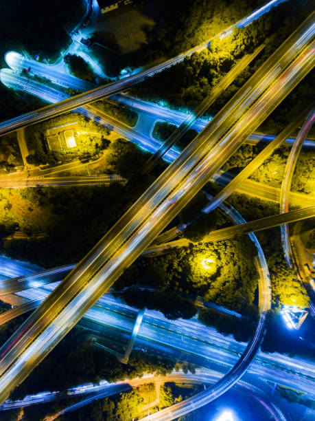 istock Aerial highway junction at night time 897223376