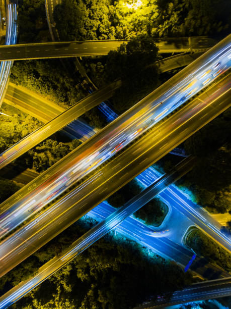 istock Aerial highway junction at night time 897223394