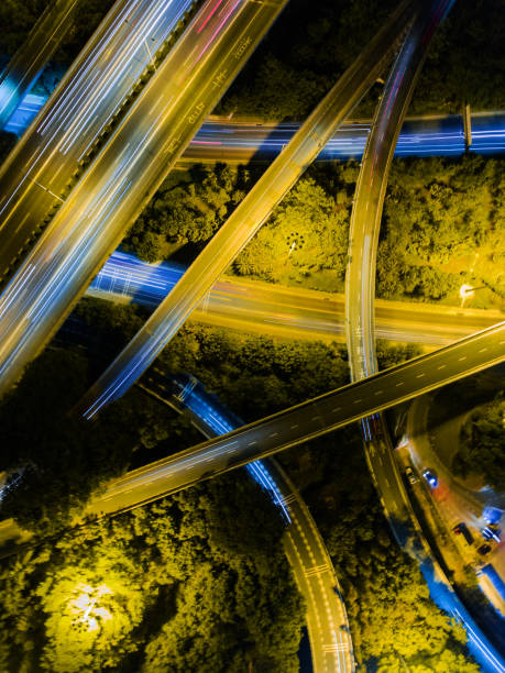 istock Aerial highway junction at night time 897223398