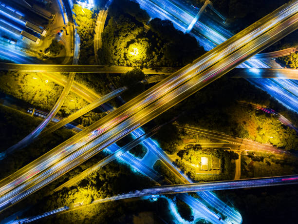 istock Aerial highway junction at night time 897223404