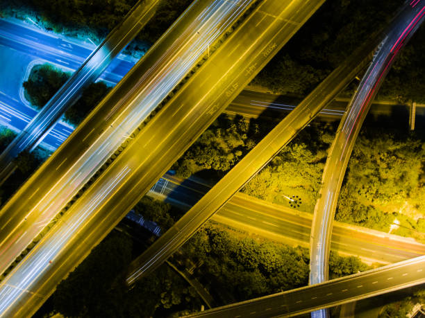 istock Aerial highway junction at night time 897223406