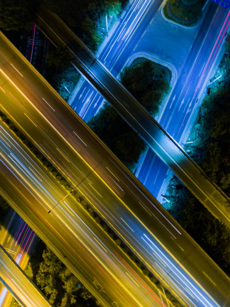 istock Aerial highway junction at night time 897226936