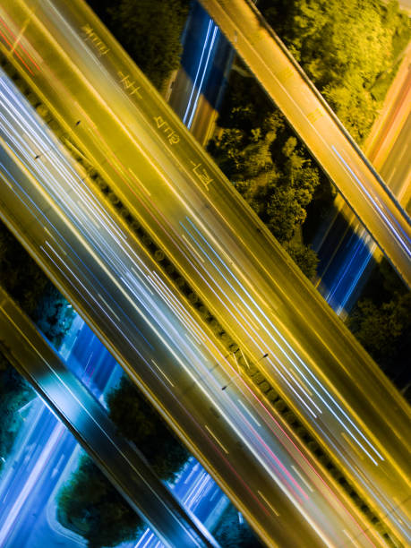 istock Aerial highway junction at night time 897226948