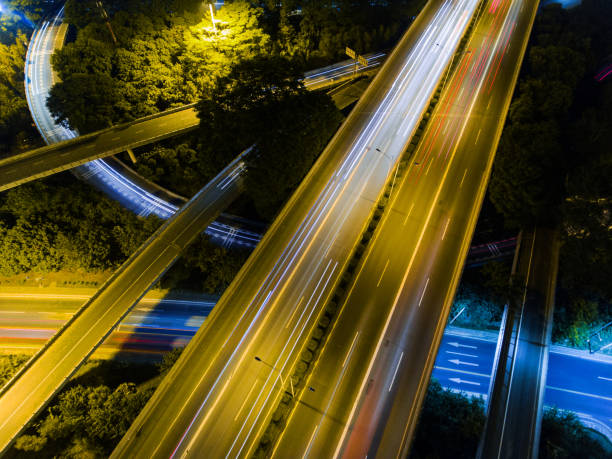 istock Aerial highway junction at night time 897226956