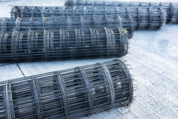 istock Rolls of steel bar for road construction on concrete road 897229604
