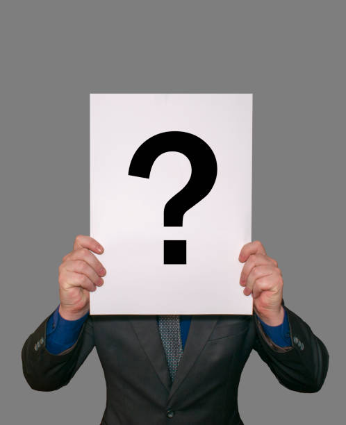 istock A man shows a white large paper A3 A2, on the paper a question mark is drawn. 897229640