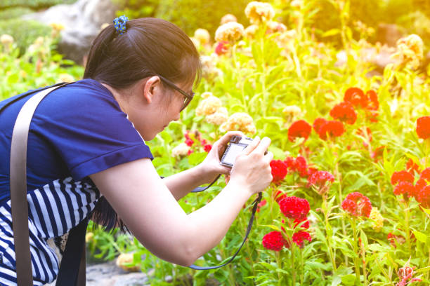 istock Female photographer with professional digital camera. 897240760