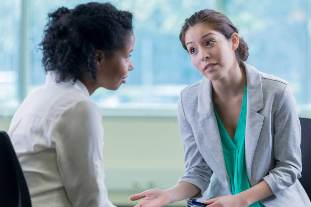 istock Serious mental health professional talks with patient 897243412