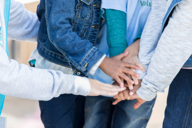 istock Children put their hands together in unity 897245730