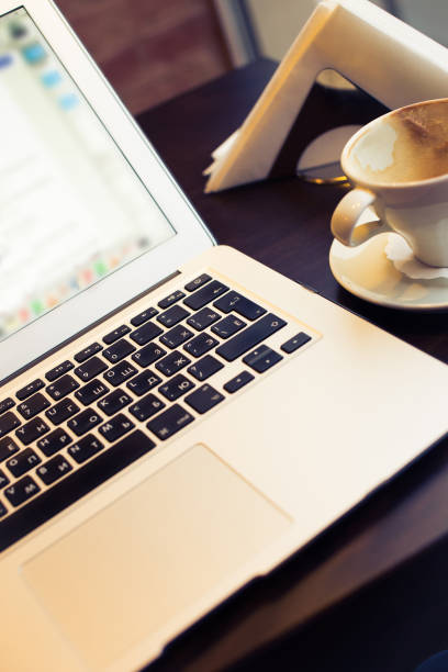 istock Laptop and drinked cup of coffee 897253210