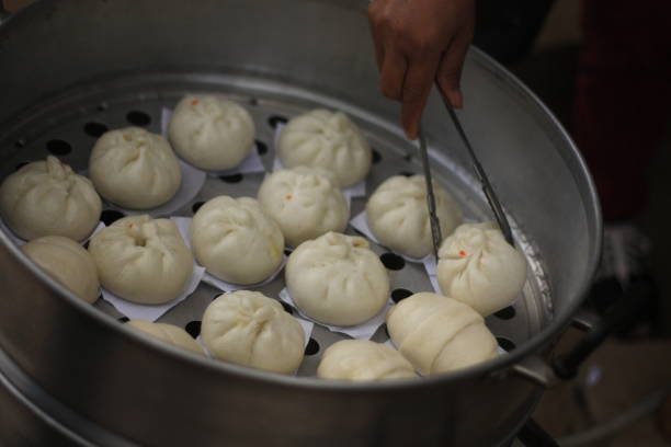 istock steamed buns being sold at market 897263068