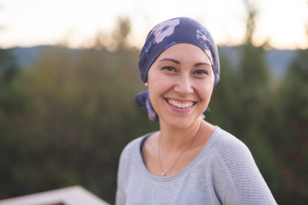 beautiful woman with cancer smiles - cancer imagens e fotografias de stock