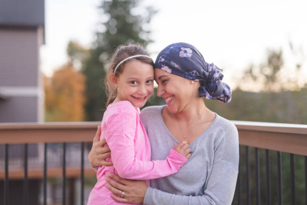 istock Mother with Cancer Hugging Daughter 897271682