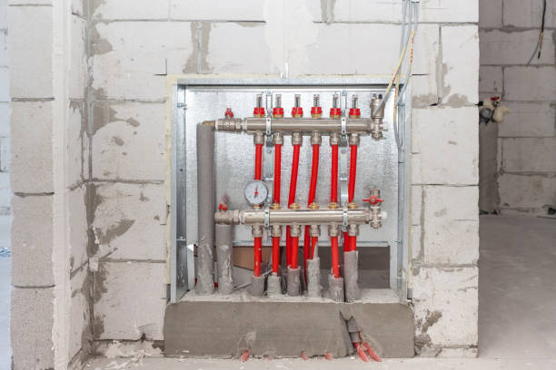 istock Domestic central heating installation, floor heating system, collector, battery. Heating concept and heating distributor. Underfloor heating with collector in the room. 897276652