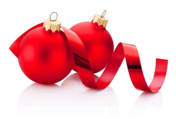 istock Two Christmas red bauble and curling paper Isolated on white background 897283338