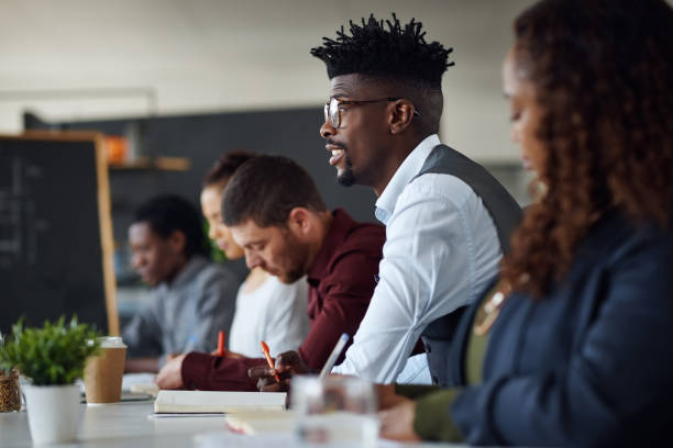 istock Listening intently to an inspiring talk 897297910