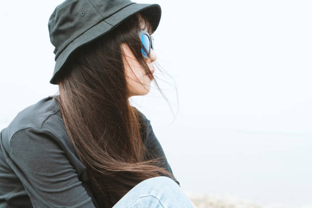 istock young style woman relax with music against sky 897308980