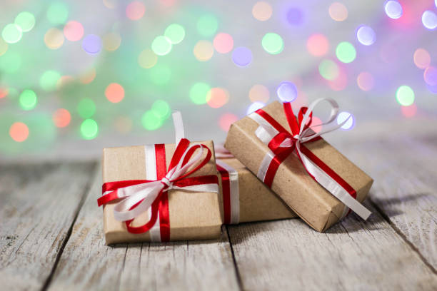 istock Christmas gift box against bokeh background. Holiday greeting card 897319104