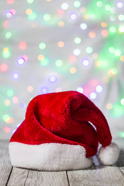 istock Red and white santa hat against bokeh background 897319108