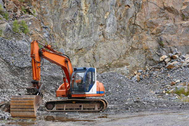 istock Quarry aggregate with heavy duty machinery. Construction industry 897329214