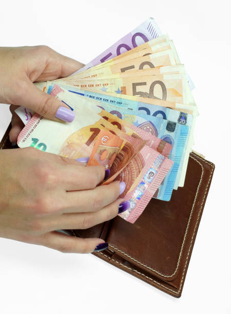 istock Hand holds euro bills in purse. Isolated on a white background. 897333116