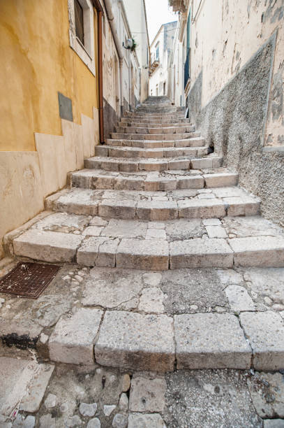 istock ancient stairs in a small Sicilian village 897335632