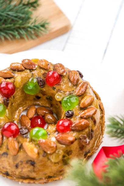 istock Glazed Christmas fruitcake with decorations 897338252