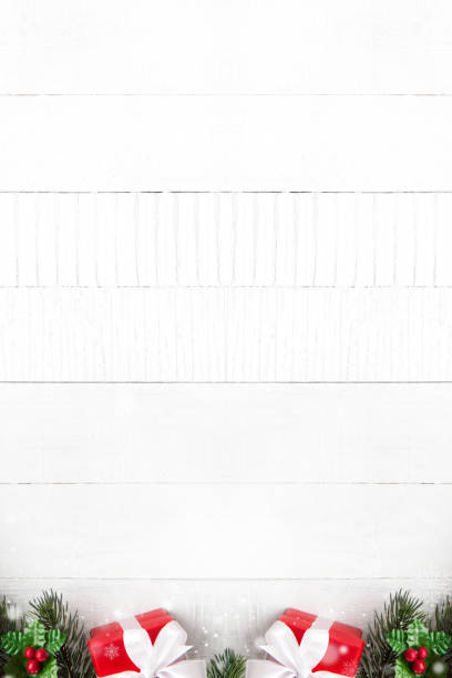 istock Colorful Christmas gift boxes on white wood background border design 897345382