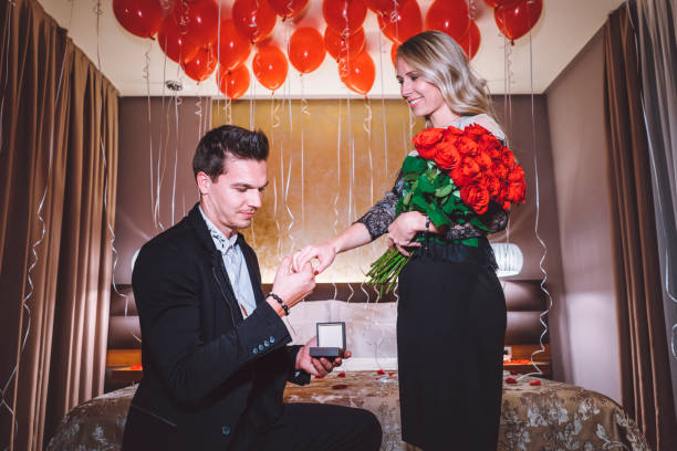 istock Handsome young man making a proposal to his girlfriend 897348086