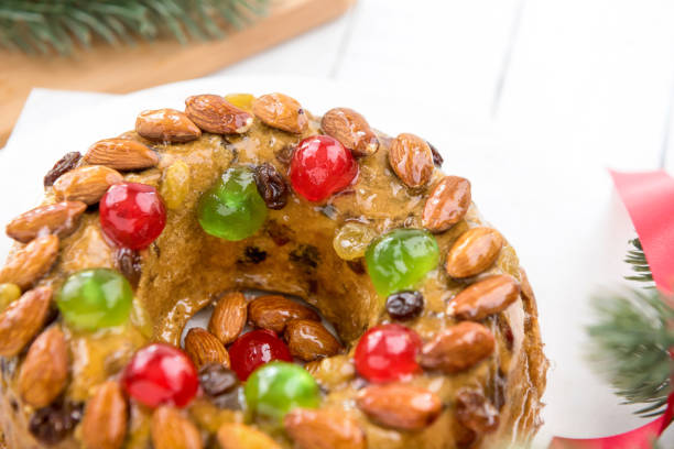 istock Beautiful delicious homemade  Christmas fruit cake on white platter 897348410