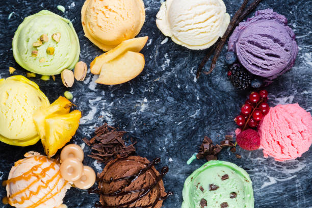 istock Selection of colorful ice cream scoops on marble background 897350576