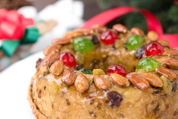 istock Beautiful delicious homemade  Christmas fruit cake on white platter 897352820