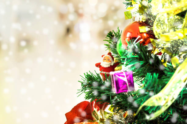 istock Tree and Christmas decorations. Beautiful decorated with present boxes in a winter landscape with snow. Can be used for background or wallpaper. 897353086